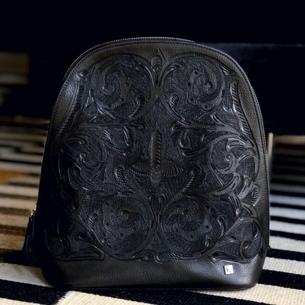 Carolina Crowley Chiseled leather backpack.